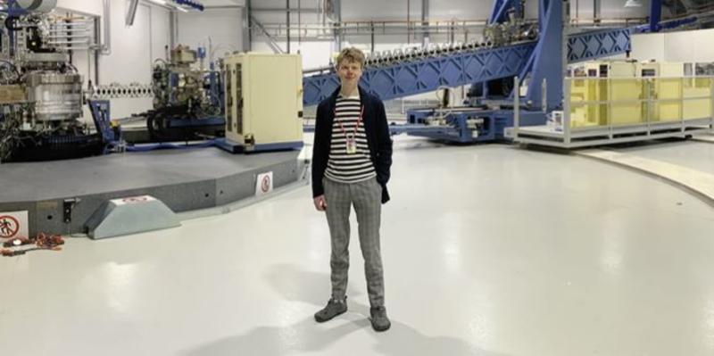 Oliver Thomas standing in a large lab
