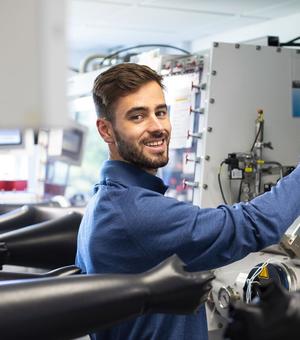 Dr Aspinall at work, using his lab's glovebox